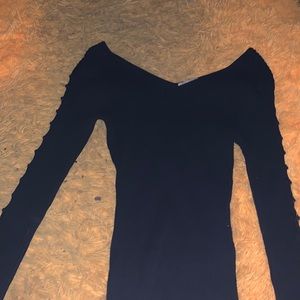 Black long sleeve sweater. With cute design on sides. V neck. Size medium.